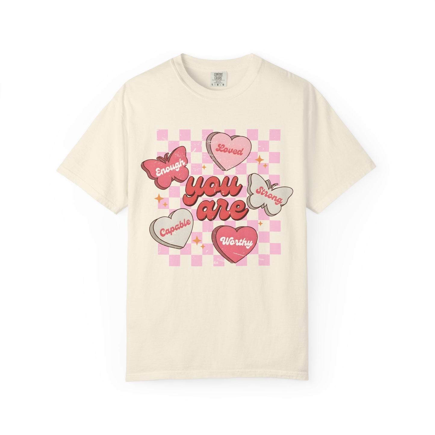 Cream inspirational butterfly t-shirt with colorful graphics and self love affirmations on a white background